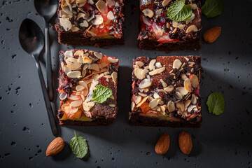 Sweet and homemade brownie with chocolate and fruits.