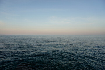Aegean Sea in Crete. White clouds and blue sky. Sea distances and the horizon.	