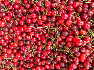 lots of red ripe cherries vitamins delicious food healthy food as background