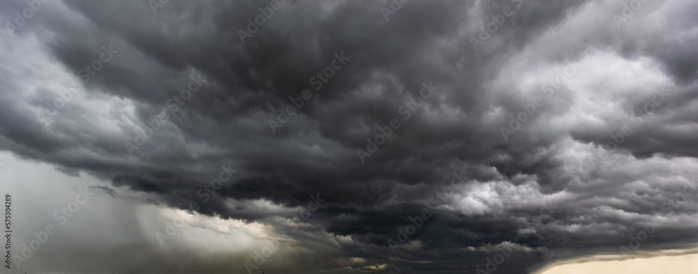 Poster the dark sky with heavy clouds converging and a violent storm before the rain.bad or moody weather s