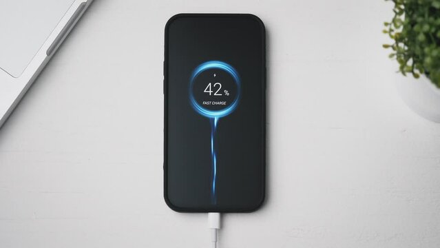 Smarthpone charging really fast, using special turbo charge technology. Quick speed charging of a mobile phone.