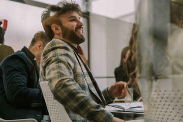 Fototapeta premium A young good looking male business person smiling