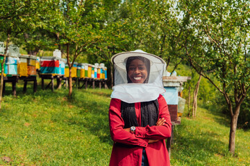 Portrait of an Arab investor located on a large honey farm. Investing in small businesses