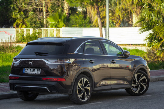 Side; Turkey &ndash; February 05 2023:     black Citroen  DS 7 Crossback  is parked  on the street on a warm summer day against the  park