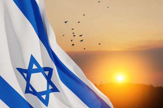 Israel flag with a star of David over cloudy sky background with flying birds on sunset. Patriotic concept about Israel with national state symbols. Banner with place for text.