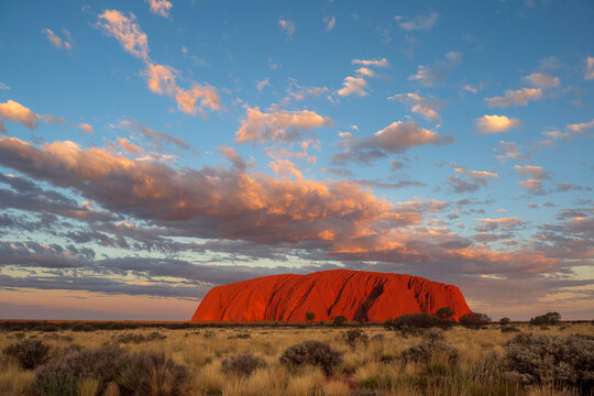 View of Uluru Rock under a cloudy sky at the end of the day, Ayers Rock, Australia