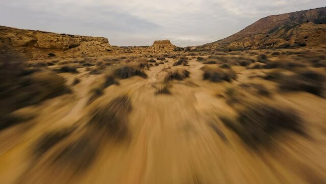 Dynamic Fpv drone shot of Bardenas Reales desert in southeast Navarre, Spain.