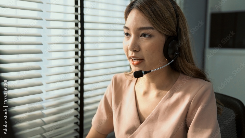 Aufkleber competent female operator working on computer and while talking with clients. concept relevant to bo