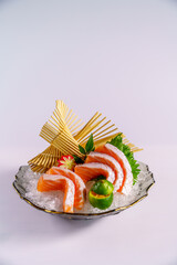 Japanese Sashimi,salmon with vegetables on white background