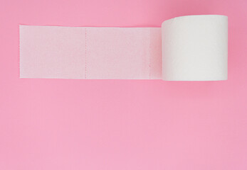 One toilet paper roll isolated on pink background. Pastel color. Hygiene concept.