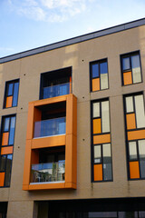 façade of colorful building in city. new modern apartment flats