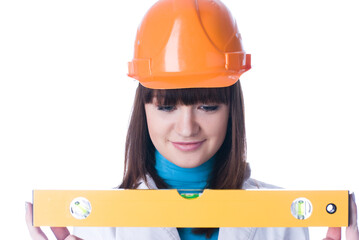 Woman in helmet with level