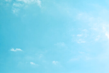 Blue pastel sky with white clouds. Soft blurred of blue sky background. Freedom of life, Positive energy and New life beginning concepts. 
