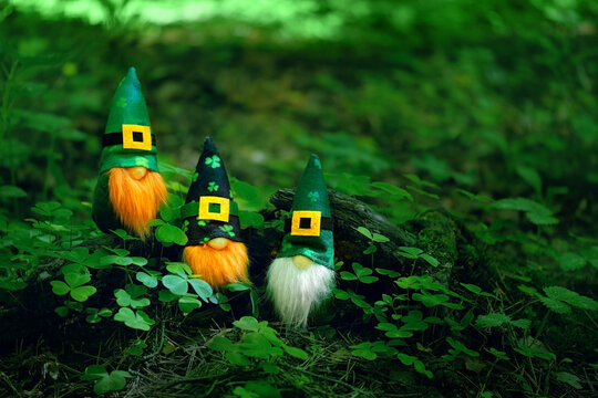 toy irish gnomes in mystery forest, abstract green natural background. magic friends dwarfs and fantasy nature. fairy tale image. harmony beautiful spring or summer season. symbol of Ireland © Ju_see