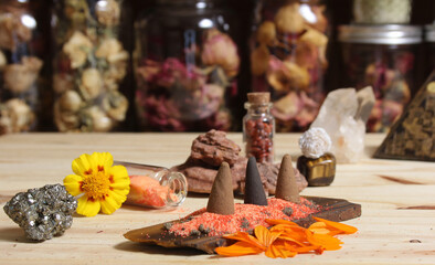 Incense Cones on Stone Slab With Crystals and Flowers