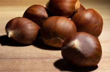 Group of chestnuts on a wood table