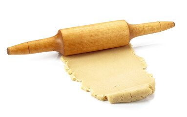 Dough and rolling pin on a white background.