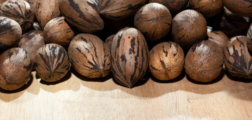 Large group of unshelled pecans