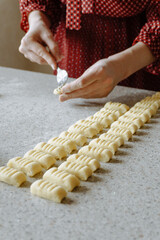 person preparing dough for gnocchi