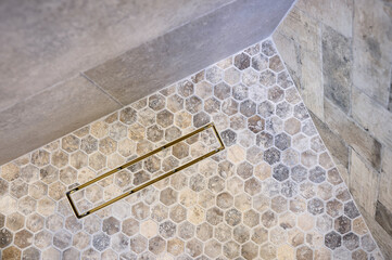 Detail of tile walls and floor in a contemporary shower