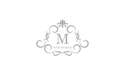 Gentle elegant monogram for cards, invitations, menus, labels with the initial letter M. Graphic design for pages, business signs, boutiques, cafes, hotels. Classic wedding invitation design elements.
