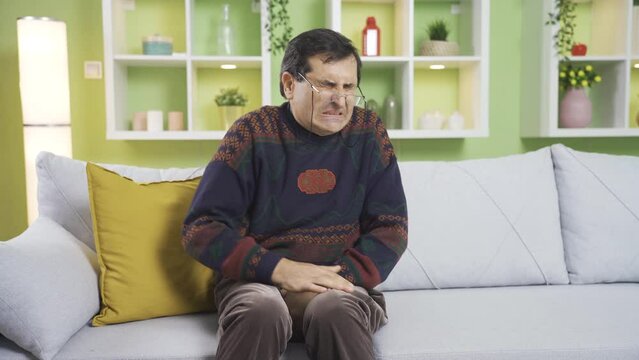 A middle-aged mature man with prostate cancer frequently goes to the bathroom to urinate.
A mature man with prostate disease cannot hold back his urine and quickly goes to the toilet.
