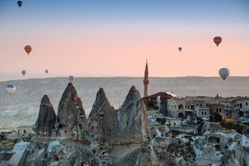 Amazing aerial view of hot air balloons at sunrise in Goreme National Park.Uchisar Castle. Cappadocia.Turkey. Top attraction travel destinations.