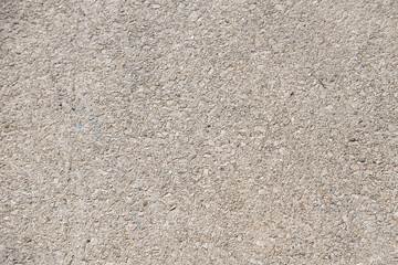 Beige cement texture on the street. Stone table background.