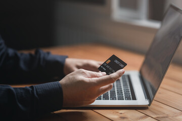 Concept e banking or e commerce : business man using his Laptop for payment by wallet app technology or digital money transfer after his shopping something by application .