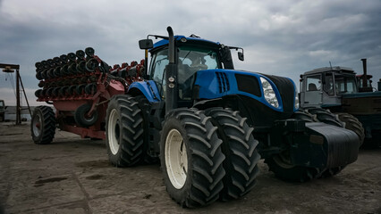 Blue powerful  tractor at the farm