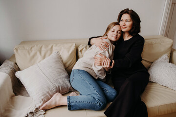 Single Mom Affectionately Hugging Teenage Daughter