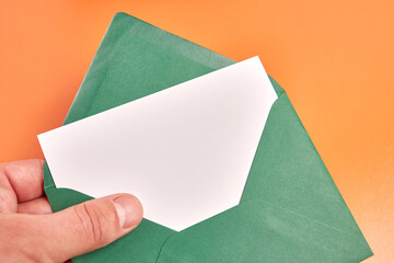 They hold an envelope with a white sheet in their hands. Banner for advertising.