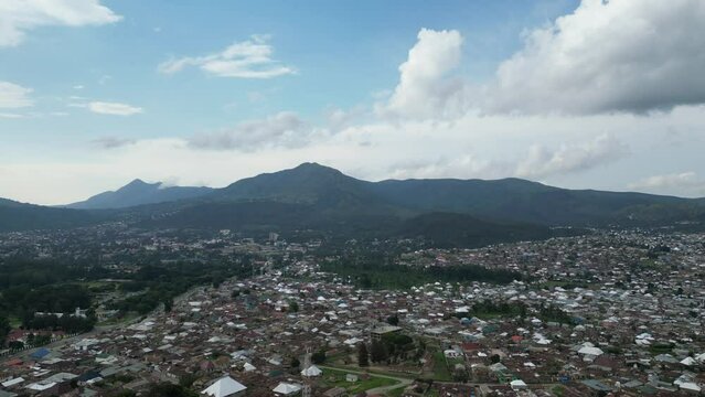 Aerial view of Mbeya city in Tanzania, Africa. Town located in south west of Tanzania. Narrow highland valley surrounded by a bowl of high mountains.