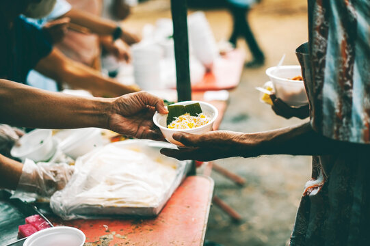 Volunteers come to provide free meals to the hungry poor : the concept of humanitarian assistance.