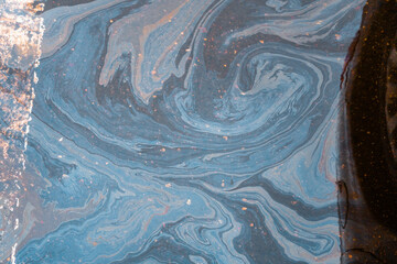Marble spills on the water from stains of gasoline and oil. Abstract background from motor oil, gas...