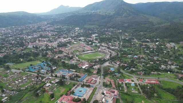 Aerial view of Mbeya city in Tanzania, Africa. Town is located in south west of Tanzania. Narrow highland valley surrounded by a bowl of high mountains.