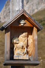 historic religious sculpture for worship at Dolomites alps, Italy 