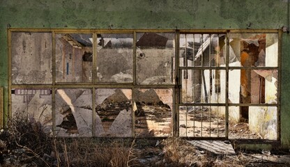 Abandoned storefront in a small town's business district.  Only rubble left.