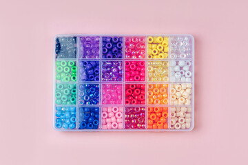 Box with multi-colored beads for children's needlework and crafts.  Handmade and DIY art activity...