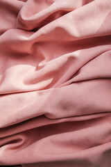 Folds of pink fabric