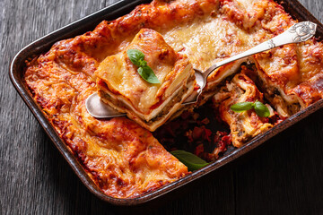 portion of Lasagna in baking dish, top view