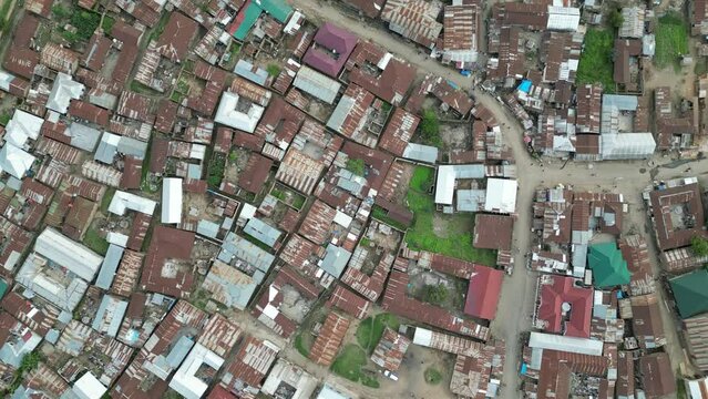 Aerial view of Mbeya city in Tanzania, Africa. Town is located in south west of Tanzania. Narrow highland valley surrounded by a bowl of high mountains.