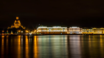 Fototapeta na wymiar Saint Isaac's Cathedral or Isaakievskiy Sobor, Admiralty building and Neva River long exposure at night, St. Petersburg, Russia 