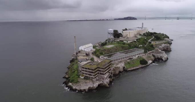 Aerial view of Alcatraz island in the San Francisco Bay. USA. The most famous Alcatraz Prison, Jail. Sightseeing Place. San Francisco Cityscape in Background