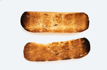 Two burnt toast slices of bread