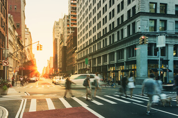 Busy cityscape street scene with people and cars in a crowded intersection on 5th Avenue in...