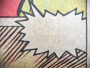 Closeup photo of a vintage comic book page with empty speech bubble and red green yellow dot print pattern on old paper background © deberarr