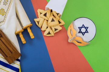 Joyous Jewish holiday celebrated traditionally with hamantaschens carnival masks to commemorate...
