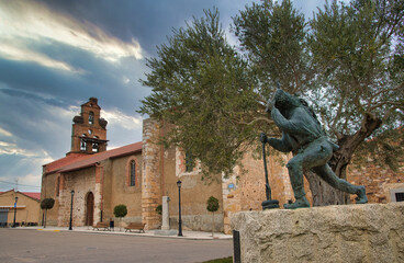 Montamarta church with Zanfarron scilpture in foreground, Zamora province, Spain