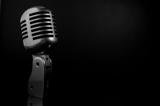 vintage microphone on black background